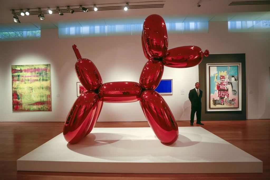 Artwork "Balloon Dog (Orange)" by artist Jeff Koons is seen during a media preview at Christie's Auction House in New York